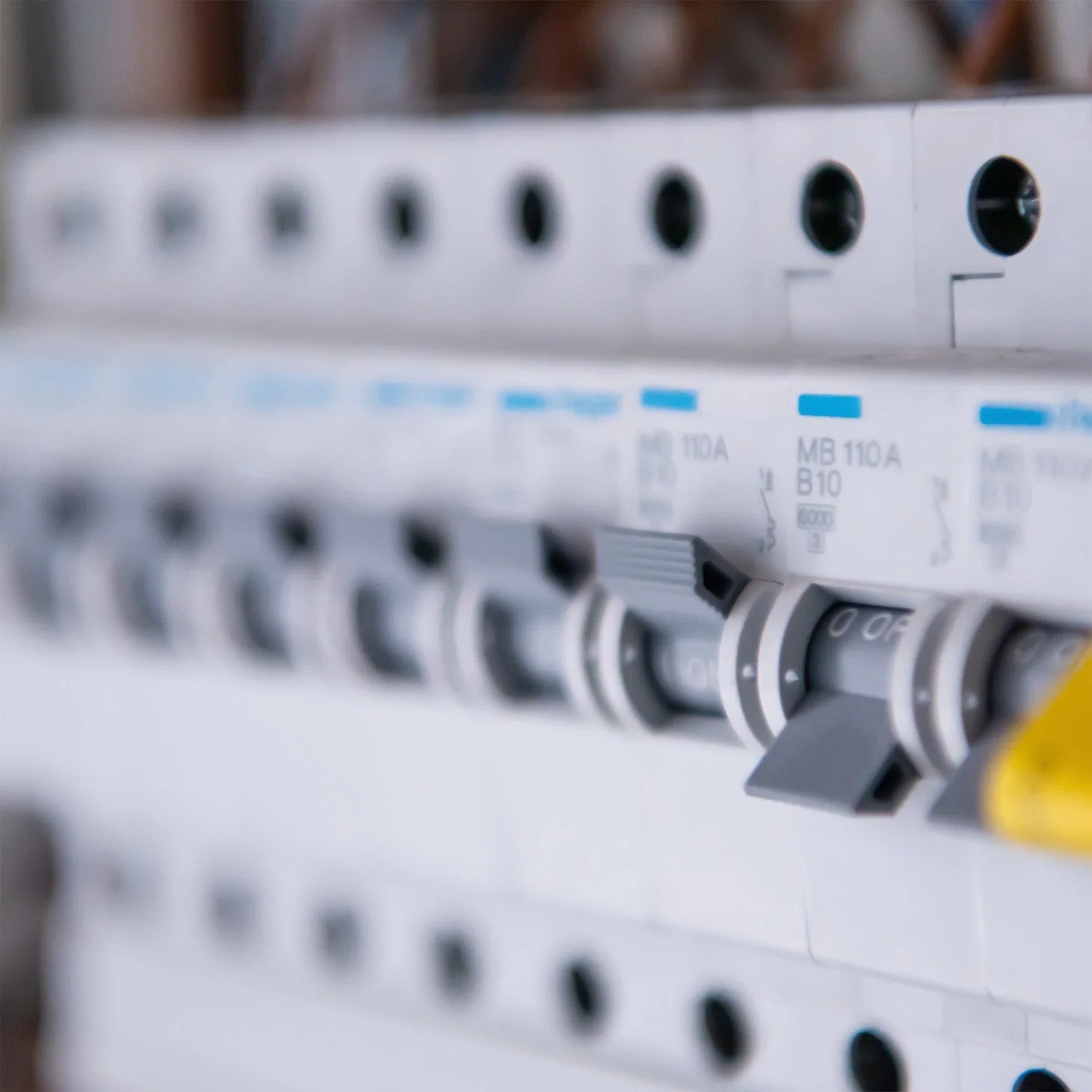 Close-up of circuit breakers and consumer unit switches for electrical safety