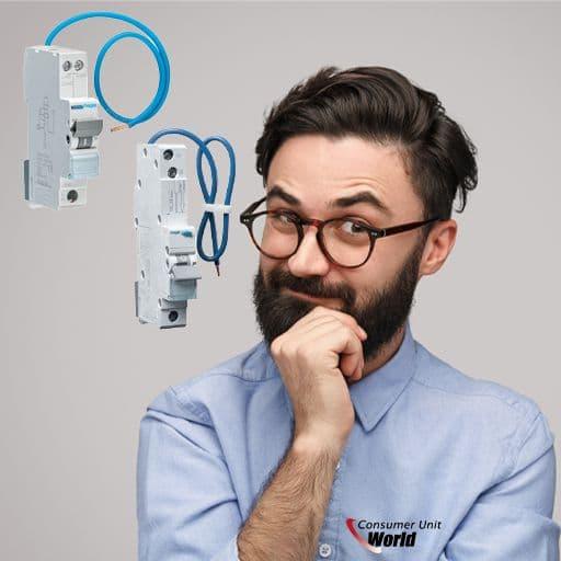 Man with glasses and beard next to two circuit breakers with blue wiring, grey background