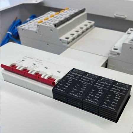 Close-up of a fuse box with circuit breakers and surge protection device installed