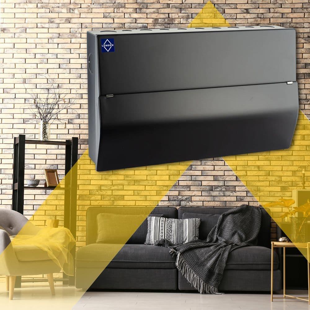 Black consumer unit displayed in a modern living room with brick wall background