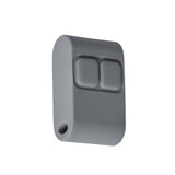 Gray plastic component with two square holes on a white background