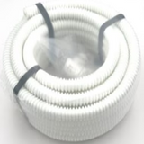 Coiled white cable with black ties on a white background