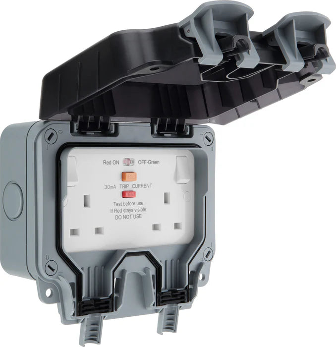 Electrical outlet with a protective cover on a white background