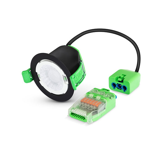 Electrical components including a black and green light fixture, connectors, and wiring on a white background.