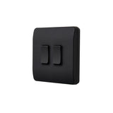 Black square switch with two double rocker switches on a white background